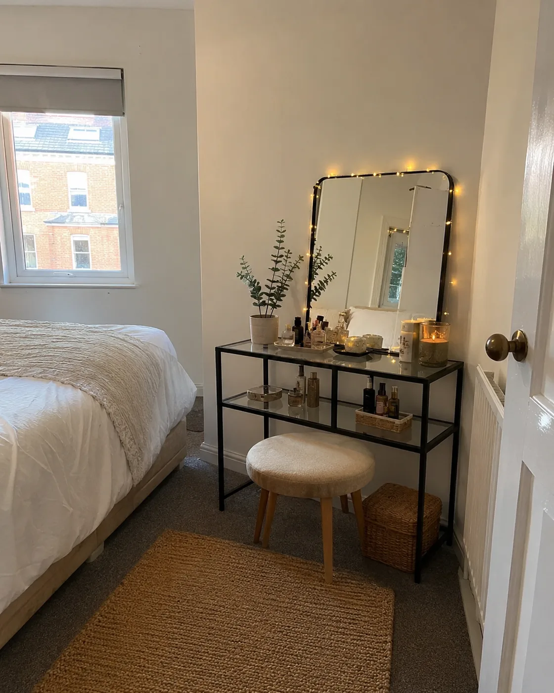 IKEA Vittsjo shelving unit used as dressing table with mirror and lights
