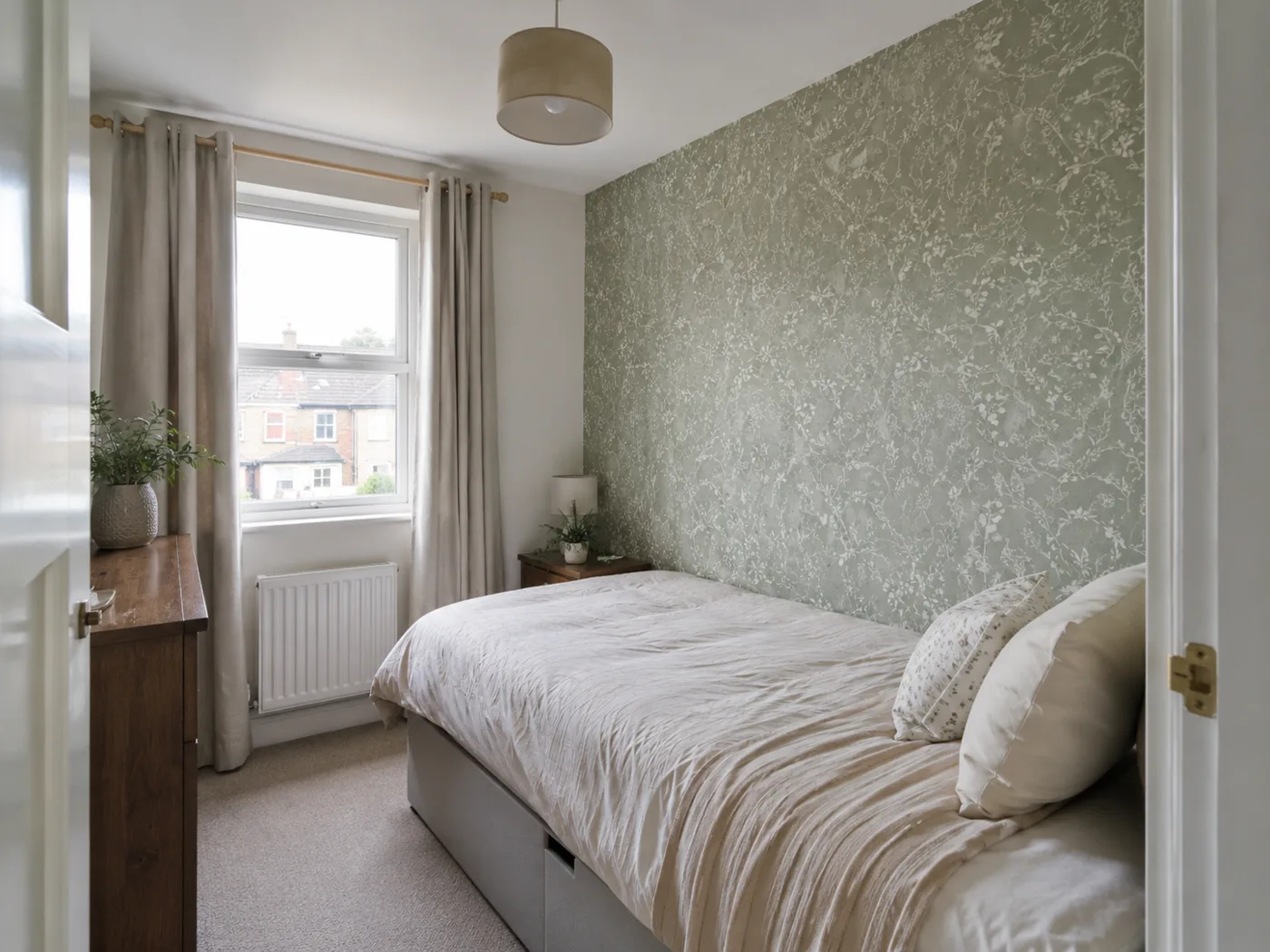 Removable peel-and-stick wallpaper feature wall in sage green