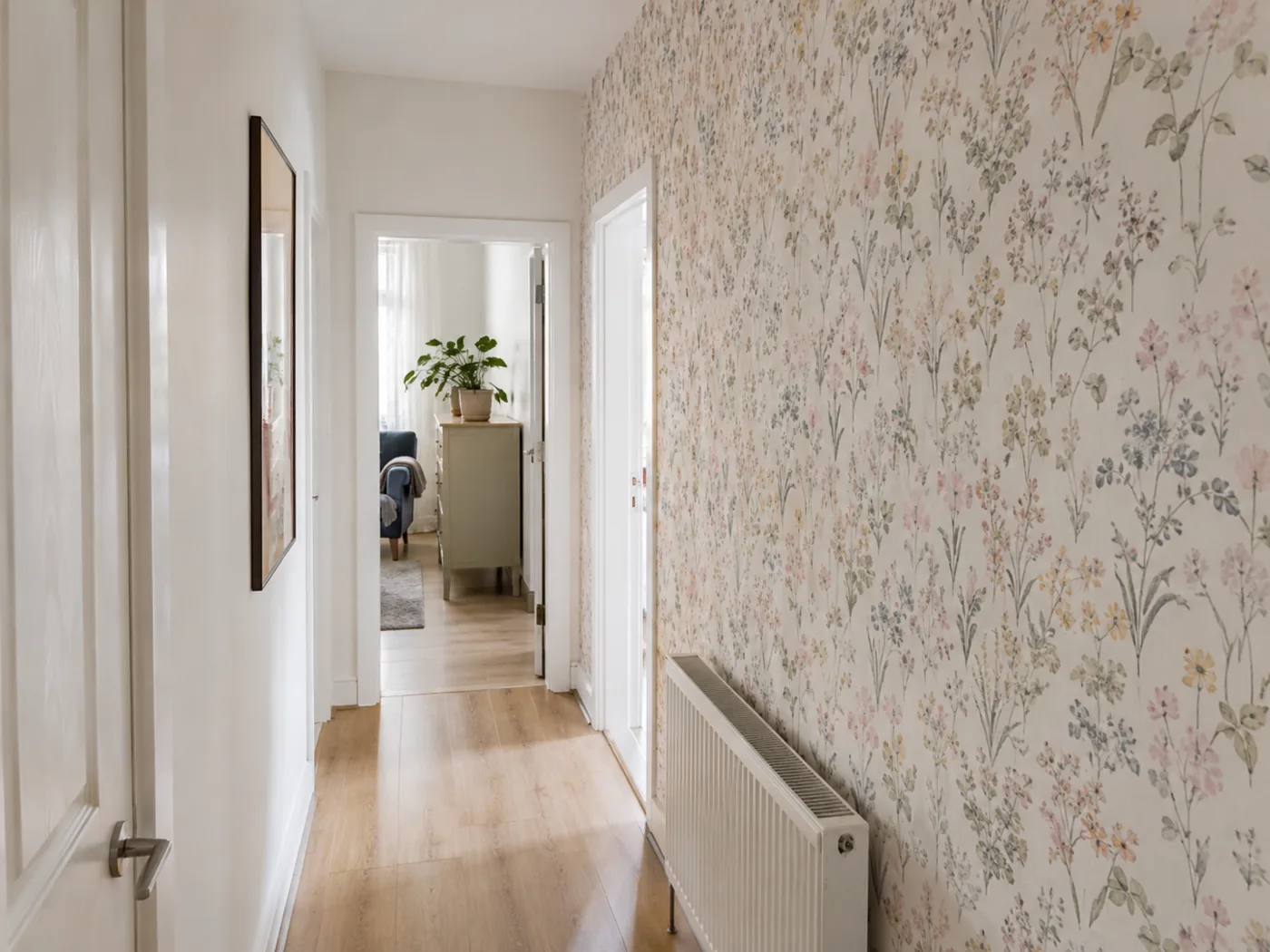 Peel and stick floral wallpaper on hallway wall